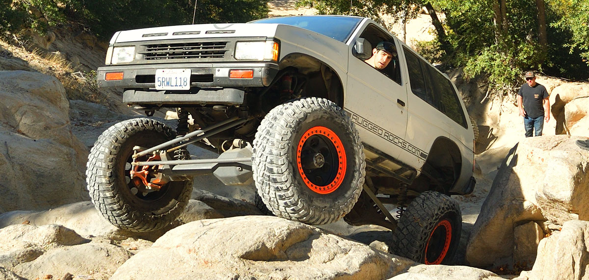 Pathfinder flexing over boulders
